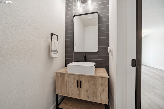 5958 SE 16th Loop, Gresham, OR 97080 - bathroom with tile walls, vanity, wood finished floors, and baseboards