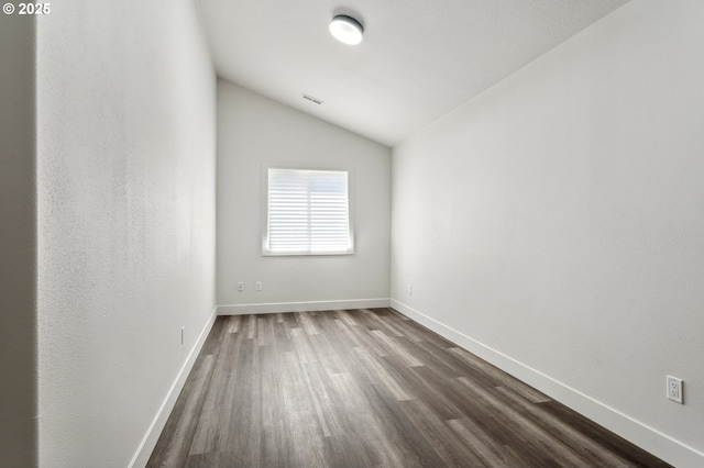 5958 SE 16th Loop, Gresham, OR 97080 - empty room featuring dark wood finished floors, vaulted ceiling, and baseboards