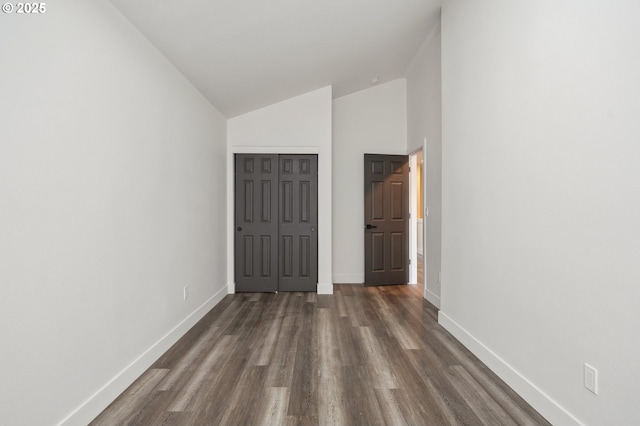 5958 SE 16th Loop, Gresham, OR 97080 - unfurnished bedroom featuring baseboards, dark wood finished floors, a closet, and high vaulted ceiling