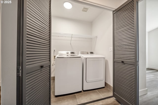 5958 SE 16th Loop, Gresham, OR 97080 - washroom featuring separate washer and dryer, baseboards, and light wood-type flooring