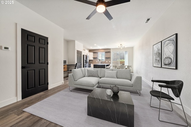 5958 SE 16th Loop, Gresham, OR 97080 - living area with wood finished floors, ceiling fan, and baseboards