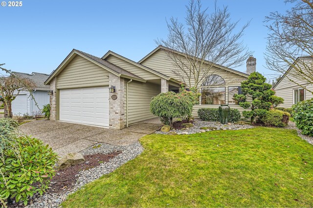 view of front of house with a front yard and a garage