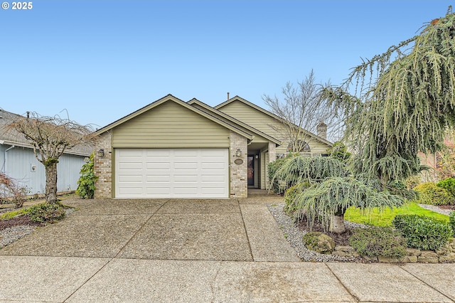 ranch-style home featuring a garage