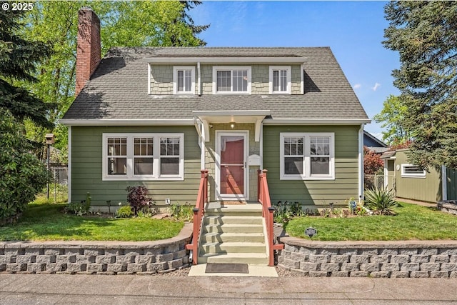 view of front of house featuring fence, a chimney, a shingled roof, and a front lawn