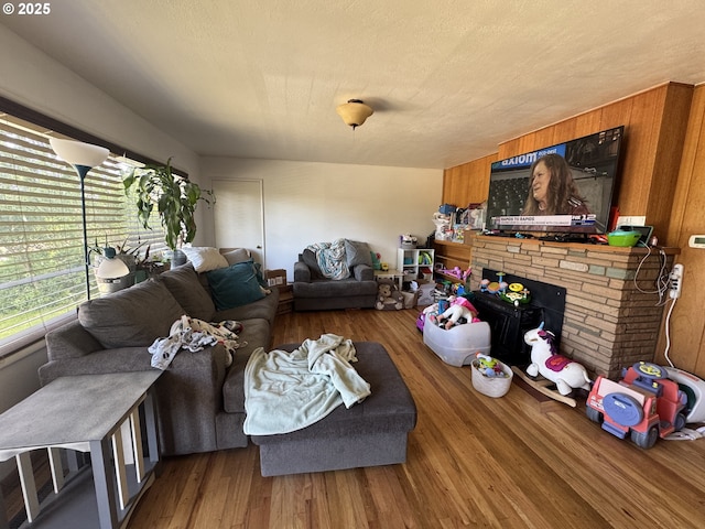 318 W 20th St, The Dalles, OR 97058 - living area with wood finished floors and a stone fireplace