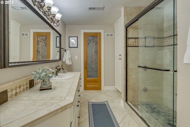 17865 NW Elk Meadow Ln, Portland, OR 97229 - full bathroom featuring vanity, a shower stall, tile patterned flooring, and a chandelier