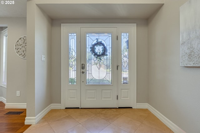17865 NW Elk Meadow Ln, Portland, OR 97229 - entryway with baseboards and light tile patterned floors
