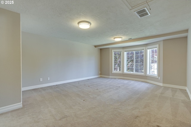 17865 NW Elk Meadow Ln, Portland, OR 97229 - spare room with a textured ceiling, baseboards, and carpet flooring