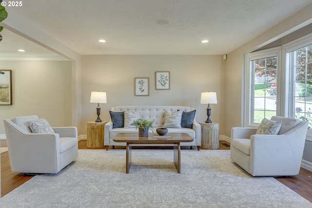17865 NW Elk Meadow Ln, Portland, OR 97229 - living area featuring wood finished floors, baseboards, recessed lighting, and ornamental molding