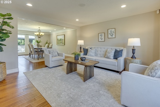 17865 NW Elk Meadow Ln, Portland, OR 97229 - living area with ornamental molding, a chandelier, light wood-type flooring, baseboards, and recessed lighting