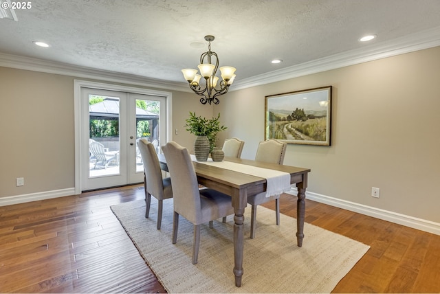 17865 NW Elk Meadow Ln, Portland, OR 97229 - dining area featuring crown molding, a chandelier, baseboards, french doors, and recessed lighting