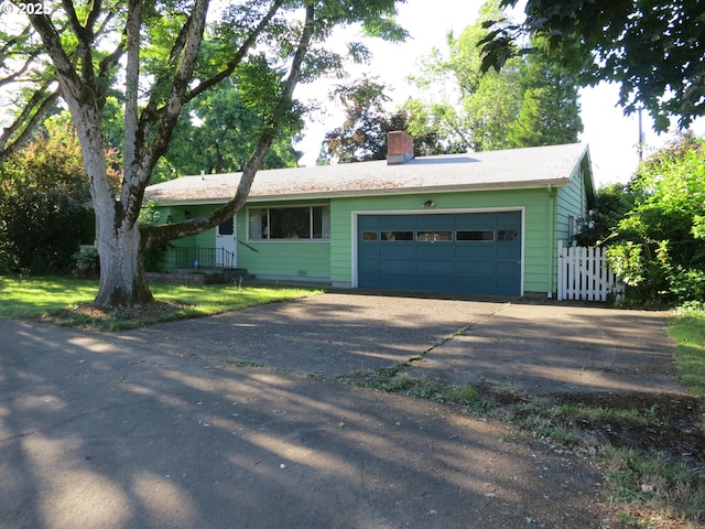 50 Allen Ave, Springfield, OR 97477 - ranch-style house featuring a chimney, a garage, and asphalt driveway