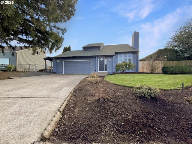 view of front facade featuring a garage and a front yard