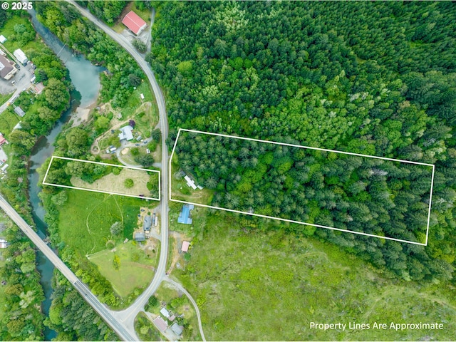 aerial view of property and surrounding area with property parcel outlined
