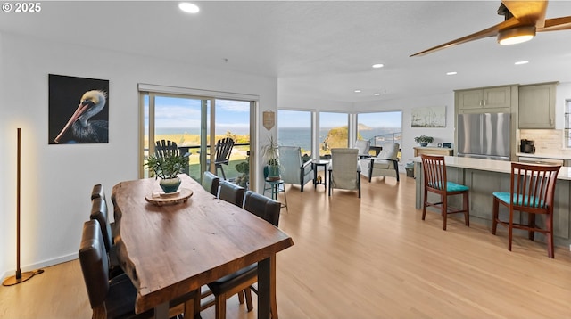 1307 Moore St Unit 704, Brookings, OR 97415 - dining space with light wood-style floors, recessed lighting, ceiling fan, and baseboards