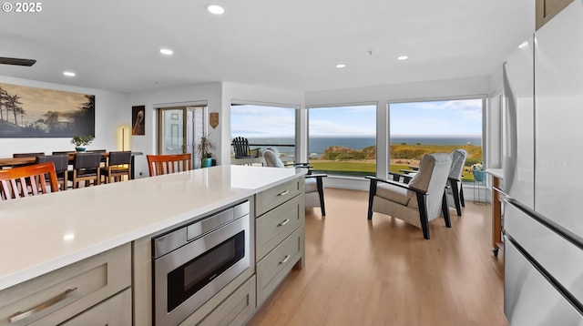 1307 Moore St Unit 704, Brookings, OR 97415 - kitchen featuring stainless steel appliances, recessed lighting, gray cabinets, light wood-style floors, and light countertops
