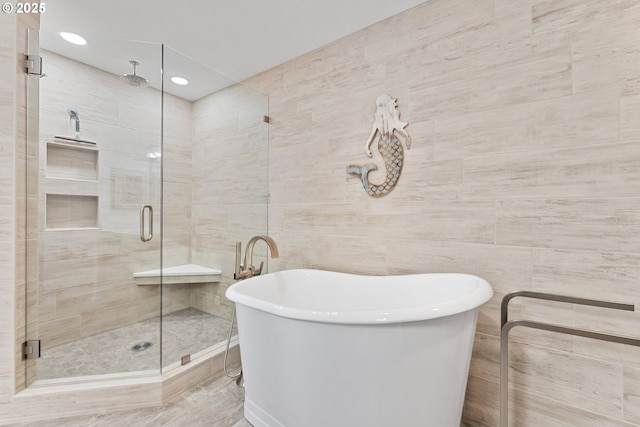 1307 Moore St Unit 704, Brookings, OR 97415 - bathroom featuring a stall shower, a freestanding bath, tile walls, and recessed lighting
