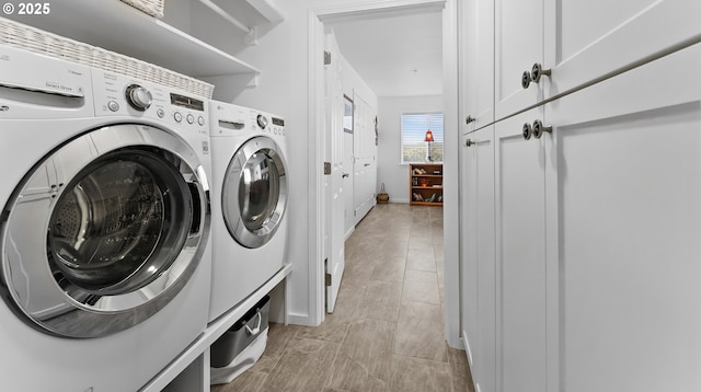 1307 Moore St Unit 704, Brookings, OR 97415 - laundry room featuring independent washer and dryer and cabinet space