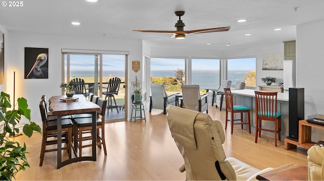 1307 Moore St Unit 704, Brookings, OR 97415 - dining space featuring ceiling fan, light wood-style flooring, plenty of natural light, a water view, and recessed lighting