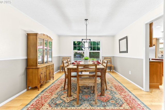 37330 SE Dodge Park Blvd, Boring, OR 97009 - dining room with light wood-style floors, a textured ceiling, baseboards, and french doors