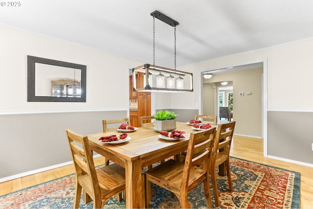 37330 SE Dodge Park Blvd, Boring, OR 97009 - dining area featuring light wood finished floors, crown molding, and baseboards