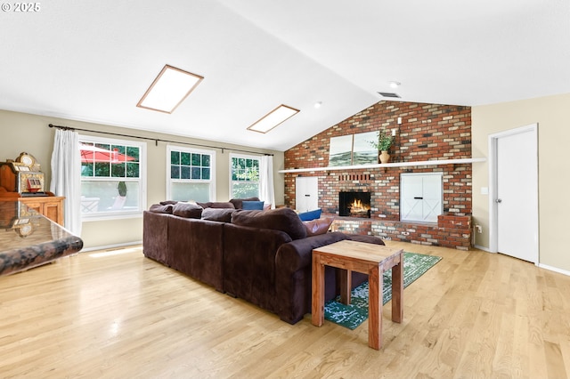 37330 SE Dodge Park Blvd, Boring, OR 97009 - living area with wood finished floors, vaulted ceiling, a brick fireplace, and baseboards