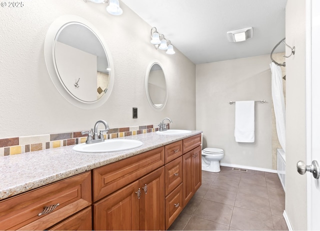 37330 SE Dodge Park Blvd, Boring, OR 97009 - bathroom featuring double vanity, tile patterned flooring, shower / bath combo with shower curtain, toilet, and baseboards