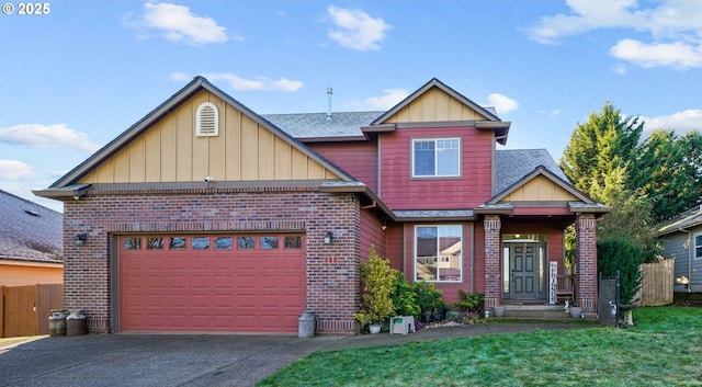 view of front of house featuring a garage and a front lawn