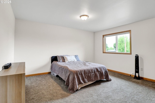 carpeted bedroom featuring baseboards