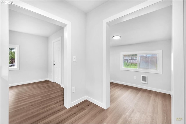 328 18th Ave, Longview, WA 98632 - hallway with wood finished floors, plenty of natural light, and baseboards