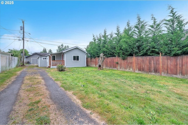328 18th Ave, Longview, WA 98632 - view of yard featuring driveway and covered porch