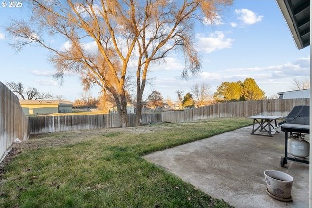 view of yard with a water view and a patio area