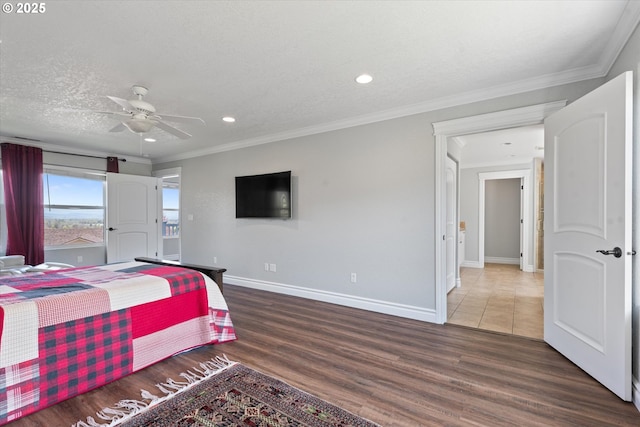 130 Ridge Dr, La Grande, OR 97850 - bedroom with crown molding, wood finished floors, baseboards, recessed lighting, and a ceiling fan