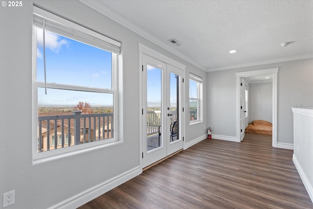 130 Ridge Dr, La Grande, OR 97850 - spare room featuring french doors, baseboards, wood finished floors, and visible vents