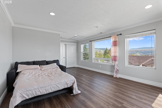 130 Ridge Dr, La Grande, OR 97850 - bedroom with crown molding, baseboards, recessed lighting, and dark wood-style floors