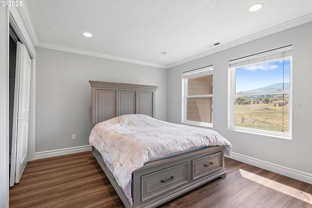 130 Ridge Dr, La Grande, OR 97850 - bedroom with baseboards, dark wood finished floors, crown molding, and visible vents