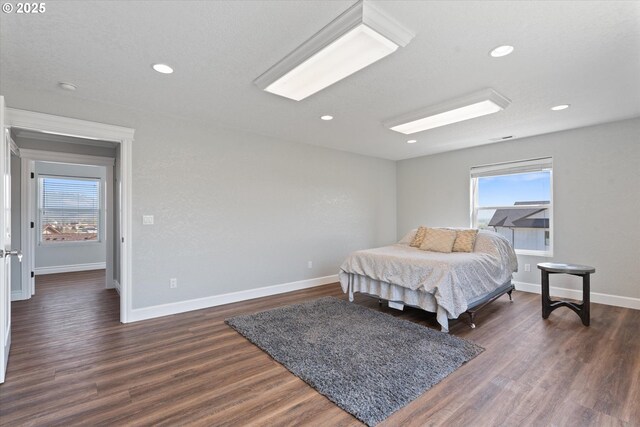 130 Ridge Dr, La Grande, OR 97850 - bedroom featuring baseboards, recessed lighting, dark wood-style floors, and multiple windows