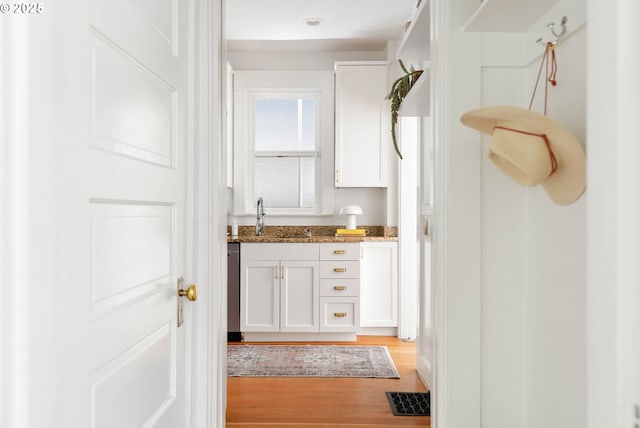 bathroom featuring vanity and wood finished floors