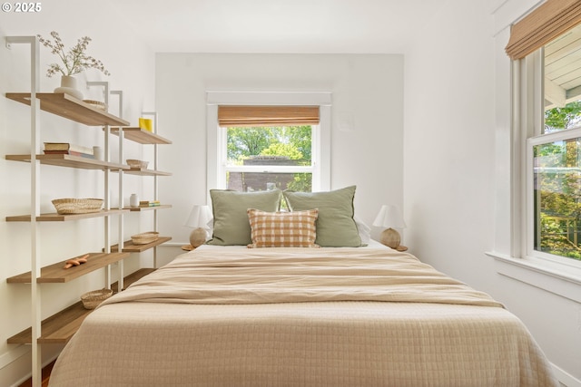 bedroom with wood finished floors