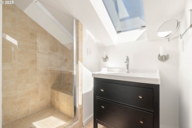 full bathroom with a stall shower, vanity, and a skylight