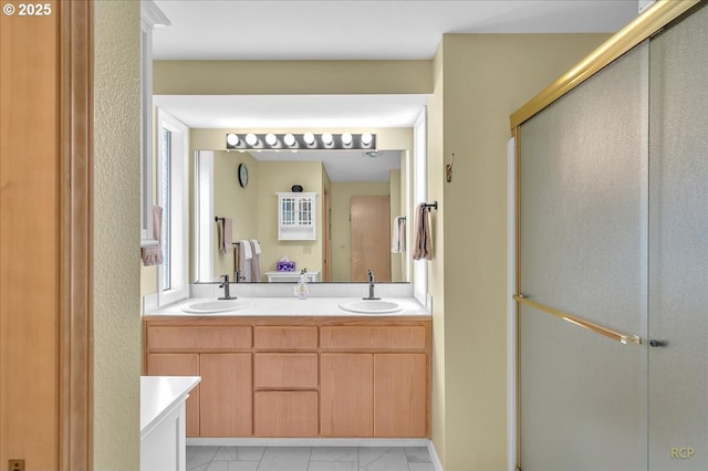 15645 NE Russell Pl, Portland, OR 97230 - full bath with marble look tiles, double vanity, and a stall shower