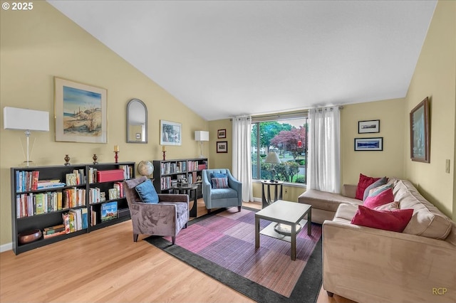 15645 NE Russell Pl, Portland, OR 97230 - living room featuring lofted ceiling and wood finished floors