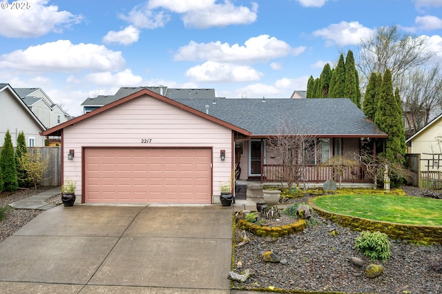 ranch-style home featuring driveway, fence, covered porch, a shingled roof, and a garage