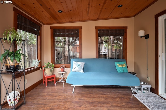 sunroom featuring wood ceiling and a healthy amount of sunlight