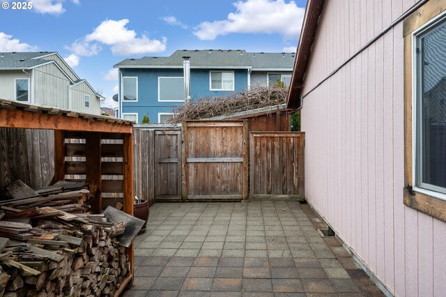 view of patio / terrace featuring a gate, visible vents, and fence