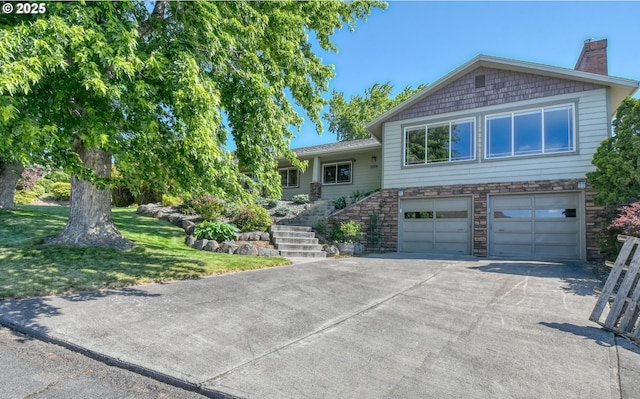 1329 NW Horn Ave, Pendleton, OR 97801 - tri-level home with concrete driveway, stairway, a garage, a chimney, and a front yard