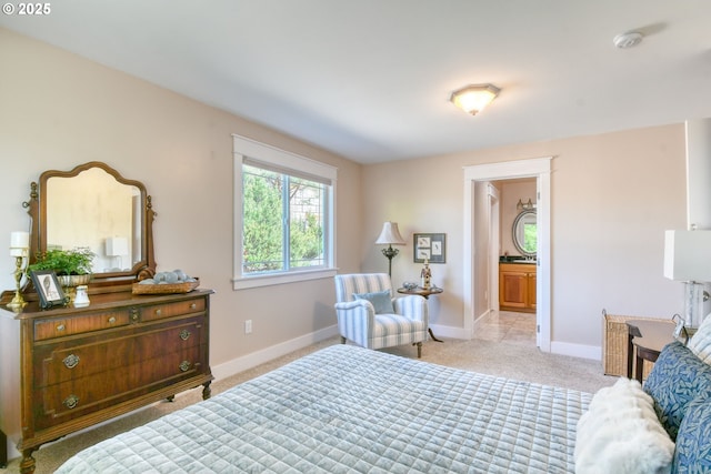 1329 NW Horn Ave, Pendleton, OR 97801 - bedroom with light carpet, baseboards, and connected bathroom