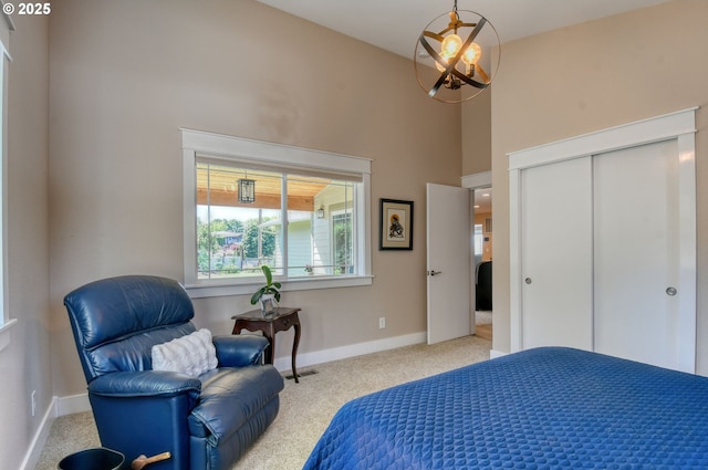 1329 NW Horn Ave, Pendleton, OR 97801 - carpeted bedroom with baseboards, a chandelier, a high ceiling, and a closet