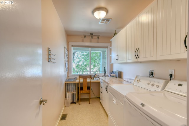 1329 NW Horn Ave, Pendleton, OR 97801 - laundry area featuring separate washer and dryer, cabinet space, baseboards, and a desk