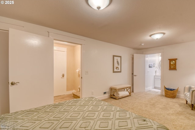 1329 NW Horn Ave, Pendleton, OR 97801 - bedroom featuring connected bathroom, light carpet, and baseboards
